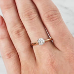 Lady wearing a 0.70ct Diamond Solitaire Ring set in 18ct Yellow & White Gold