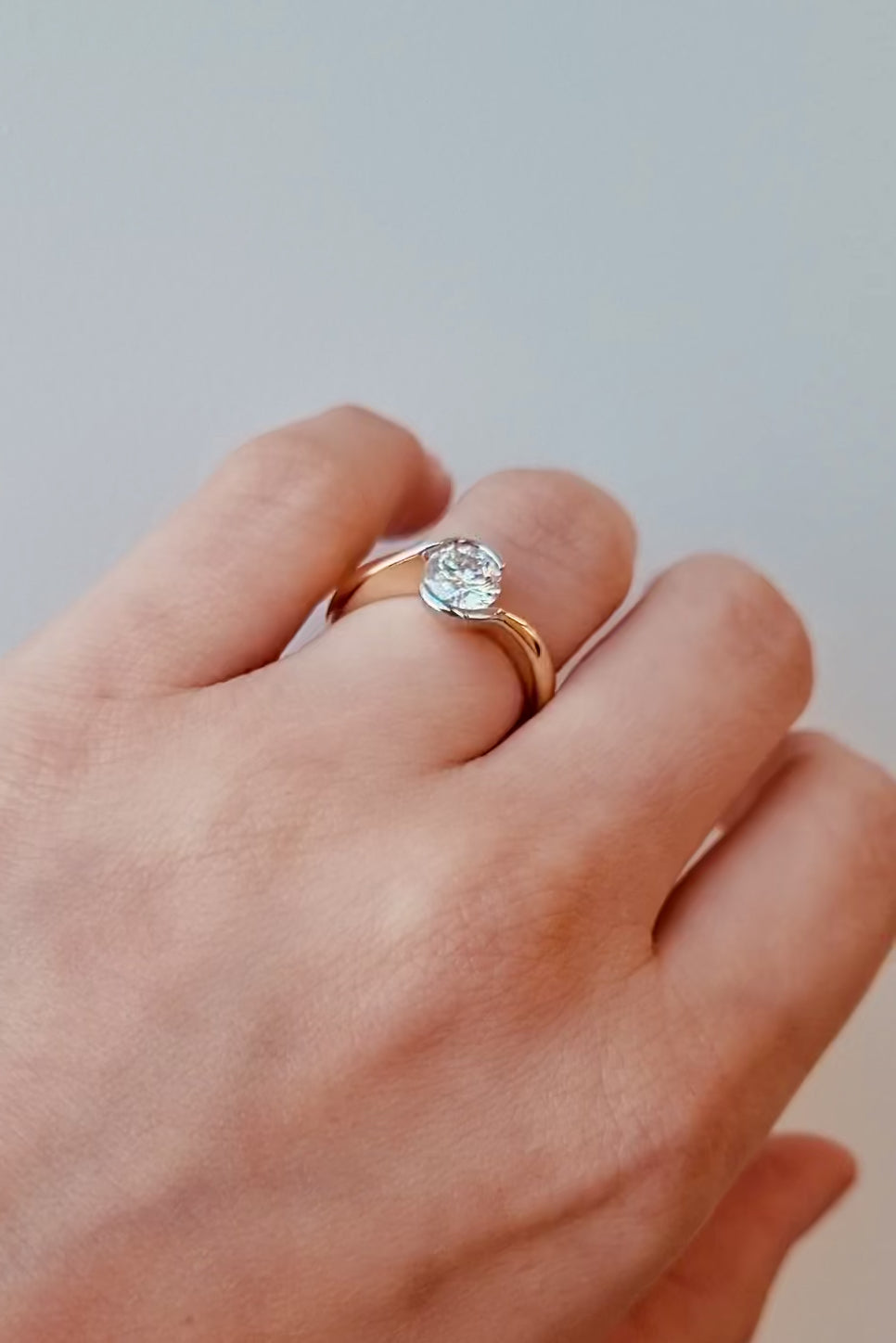 hand wearing a Wrap Style Diamond Ring in 18ct Yellow & White Gold on a white background