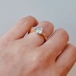 hand wearing a Wrap Style Diamond Ring in 18ct Yellow & White Gold on a white background