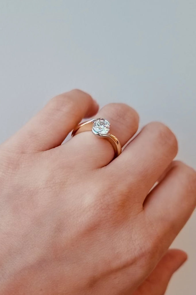 hand wearing a Wrap Style Diamond Ring in 18ct Yellow & White Gold on a white background