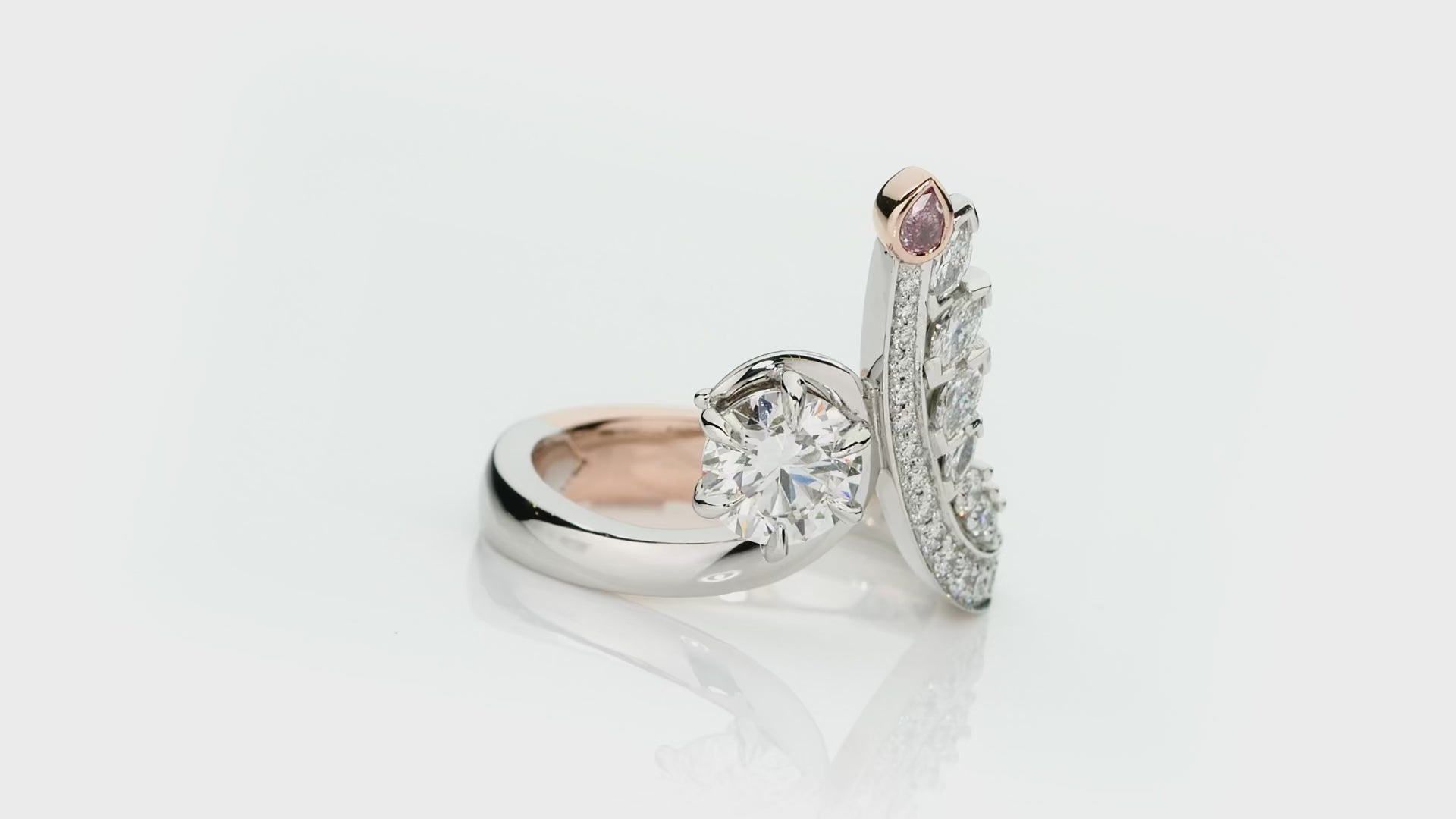 Elegant handcrafted ring with pink diamond and diamond accents on a white background. Clara ring part of The Beyond Luxury Collection by LeGassick.