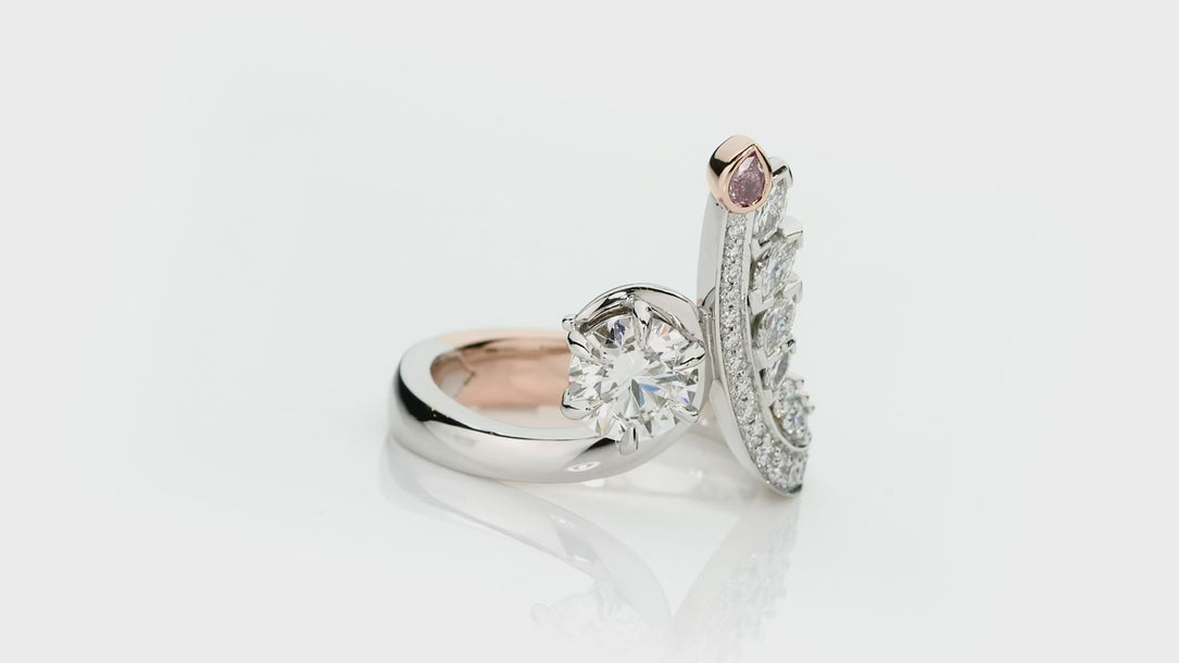 Elegant handcrafted ring with pink diamond and diamond accents on a white background. Clara ring part of The Beyond Luxury Collection by LeGassick.