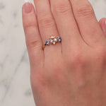 Morganite, Blue Sapphire & Diamond Dress Ring in 9ct Yellow Gold from LeGassick on a lady's finger.