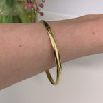 Solid 9 Carat Yellow Gold 5mm Wide Bangle available at LeGassick Diamonds and Jewellery Gold Coast, Australia.