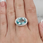 Blue Topaz & Diamond Halo Ring set in 18ct White Gold from LeGassick.