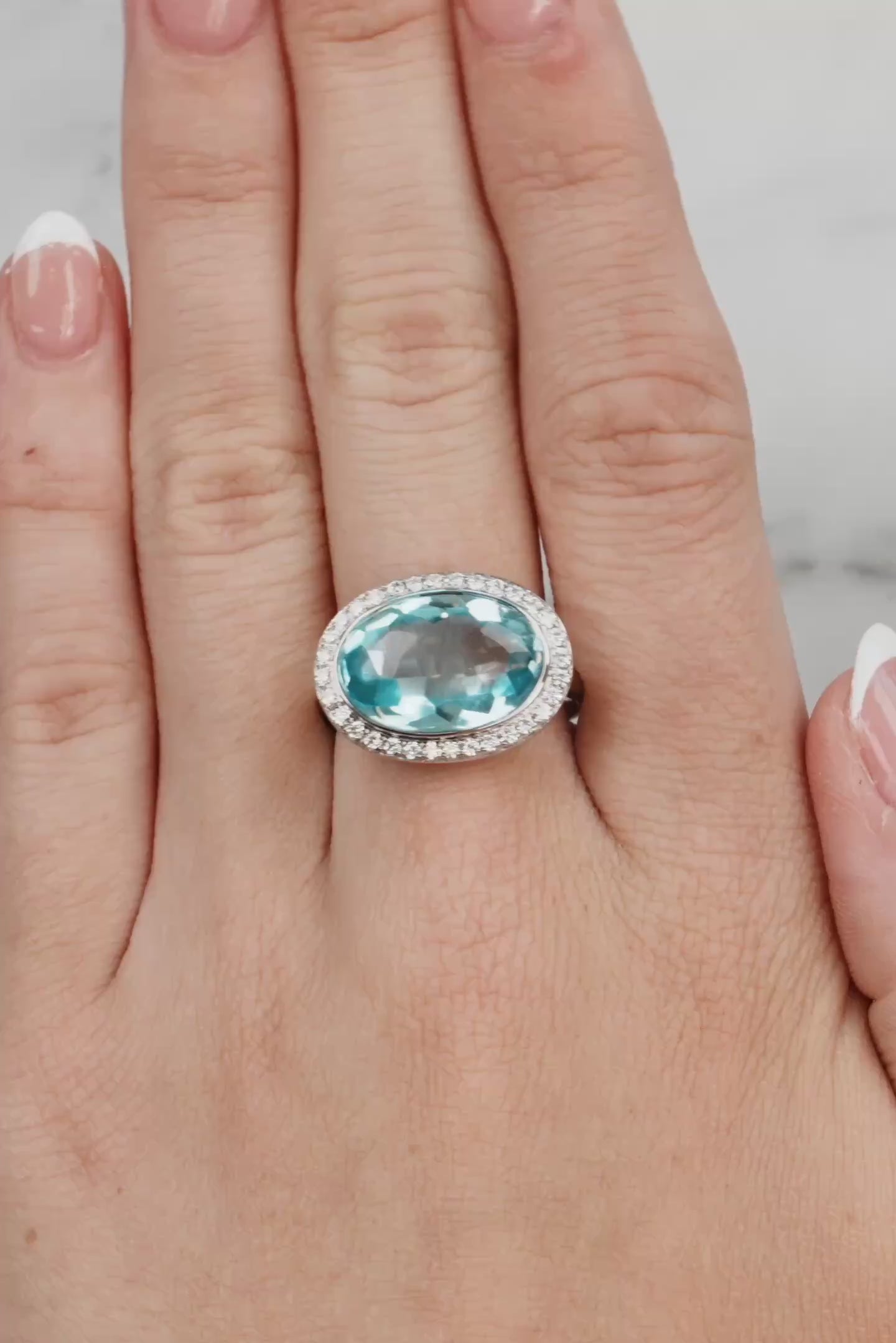 Blue Topaz & Diamond Halo Ring set in 18ct White Gold from LeGassick.