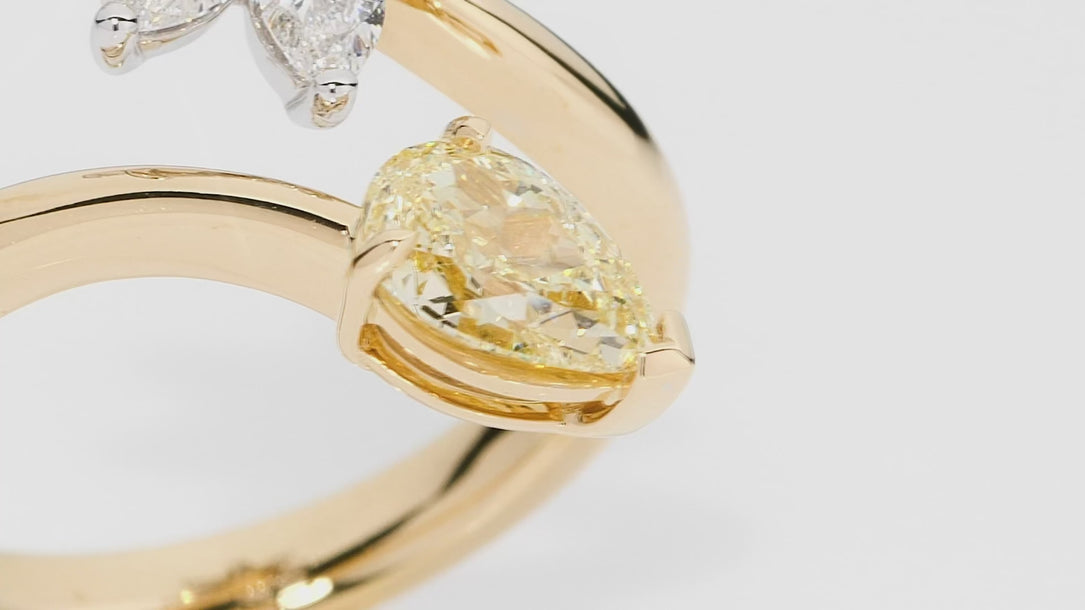 Handcrafted gold ring with yellow and clear diamonds on a white background. Eden ring part of The Beyond Luxury Collection by LeGassick.