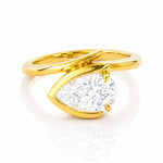 Gold ring with a large lab diamond on a white background