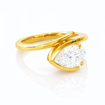 Gold ring with a large lab diamond on a white background