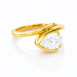 Gold ring with a large lab diamond on a white background
