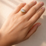 Gold ring with a large lab diamond on a lady's hand