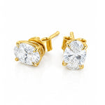 A pair of yellow gold stud earrings with round brilliant-cut clear diamonds in a four-prong setting, shown on a clean white background.