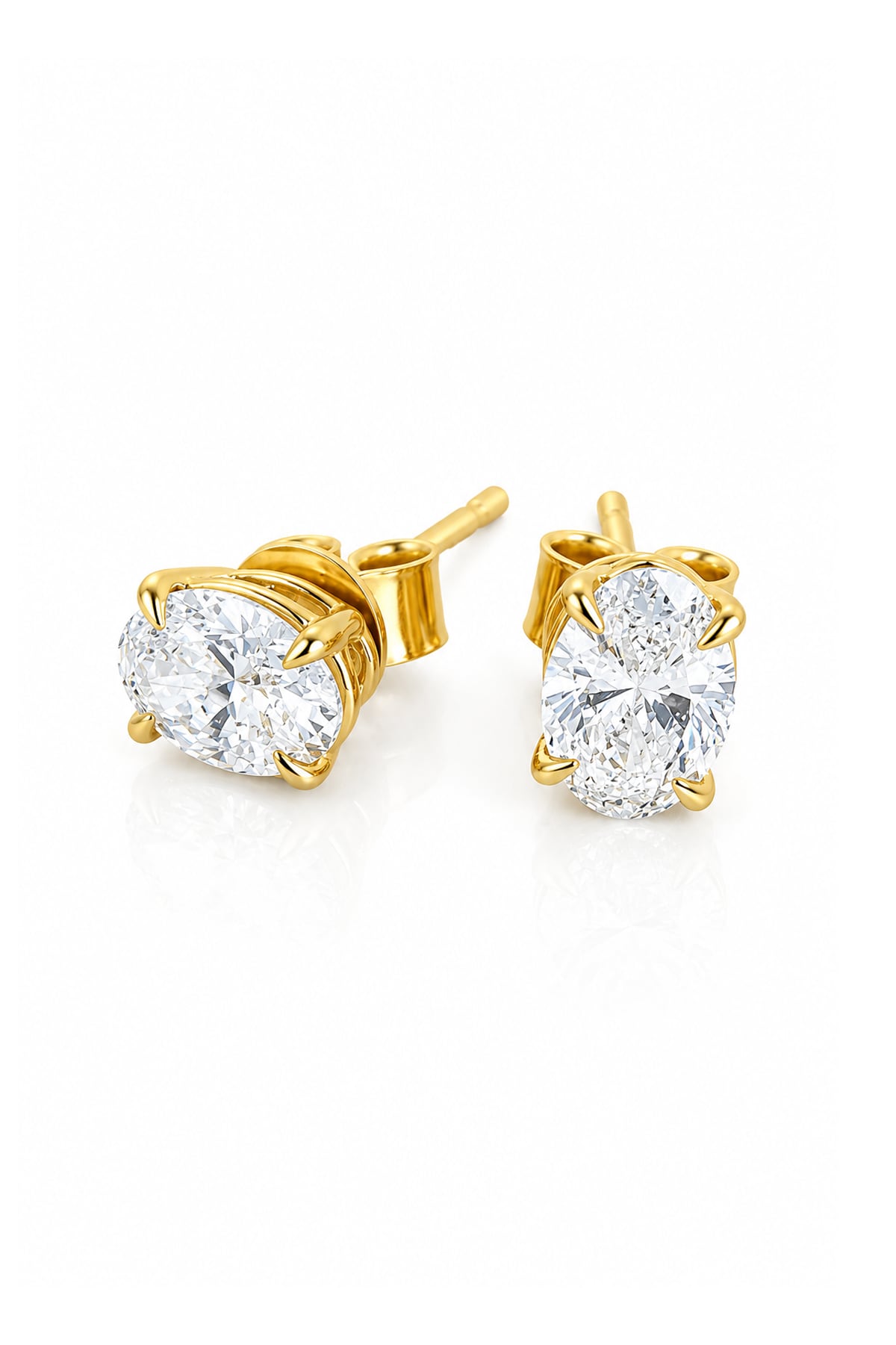 A pair of yellow gold stud earrings with round brilliant-cut clear diamonds in a four-prong setting, shown on a clean white background.