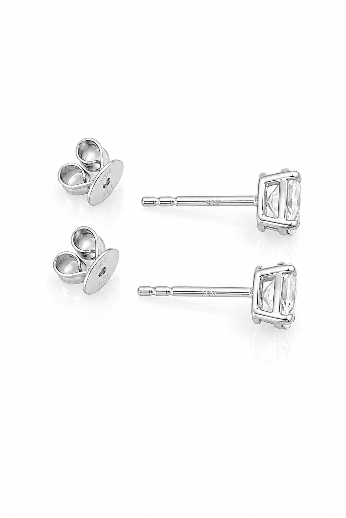 A pair of white gold stud earrings with oval clear diamonds and butterfly backings, displayed on a clean white background.